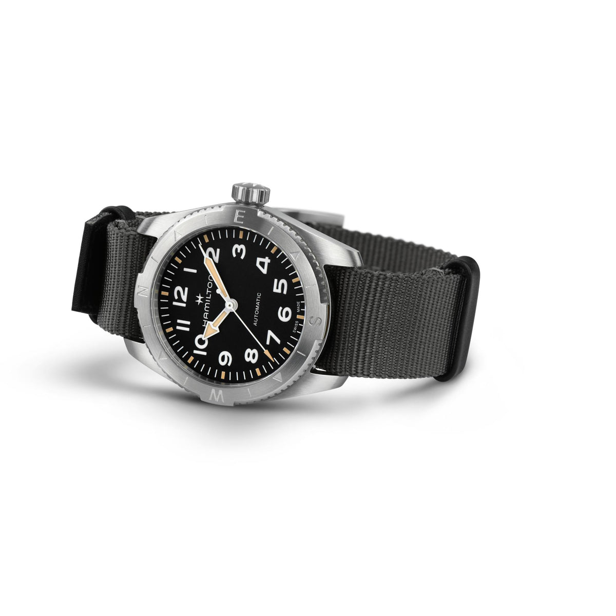 Men’s automatic field watch with black dial, silvertone case, and dark NATO strap