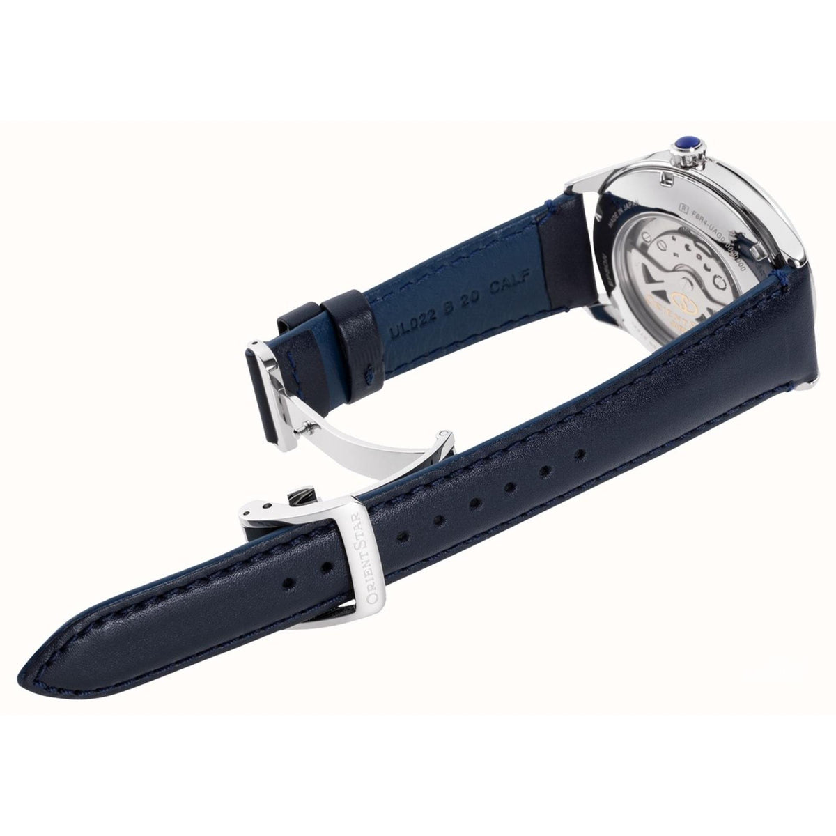 Automatic watch with blue leather strap and metal buckle, side/back case view