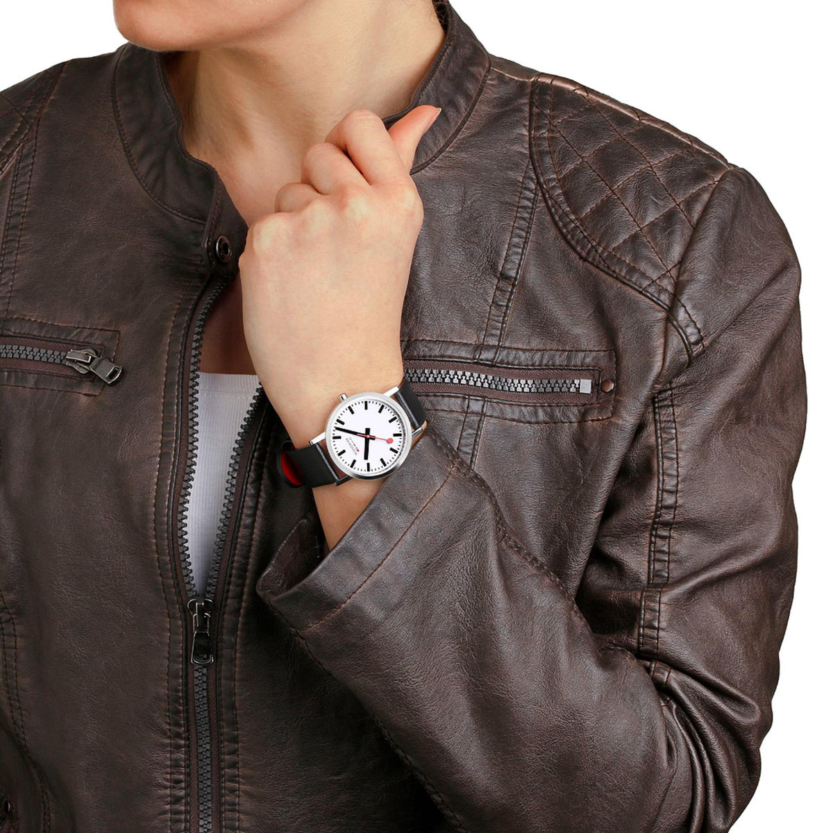 Quartz watch on brown leather jacket sleeve, white dial and black leather band