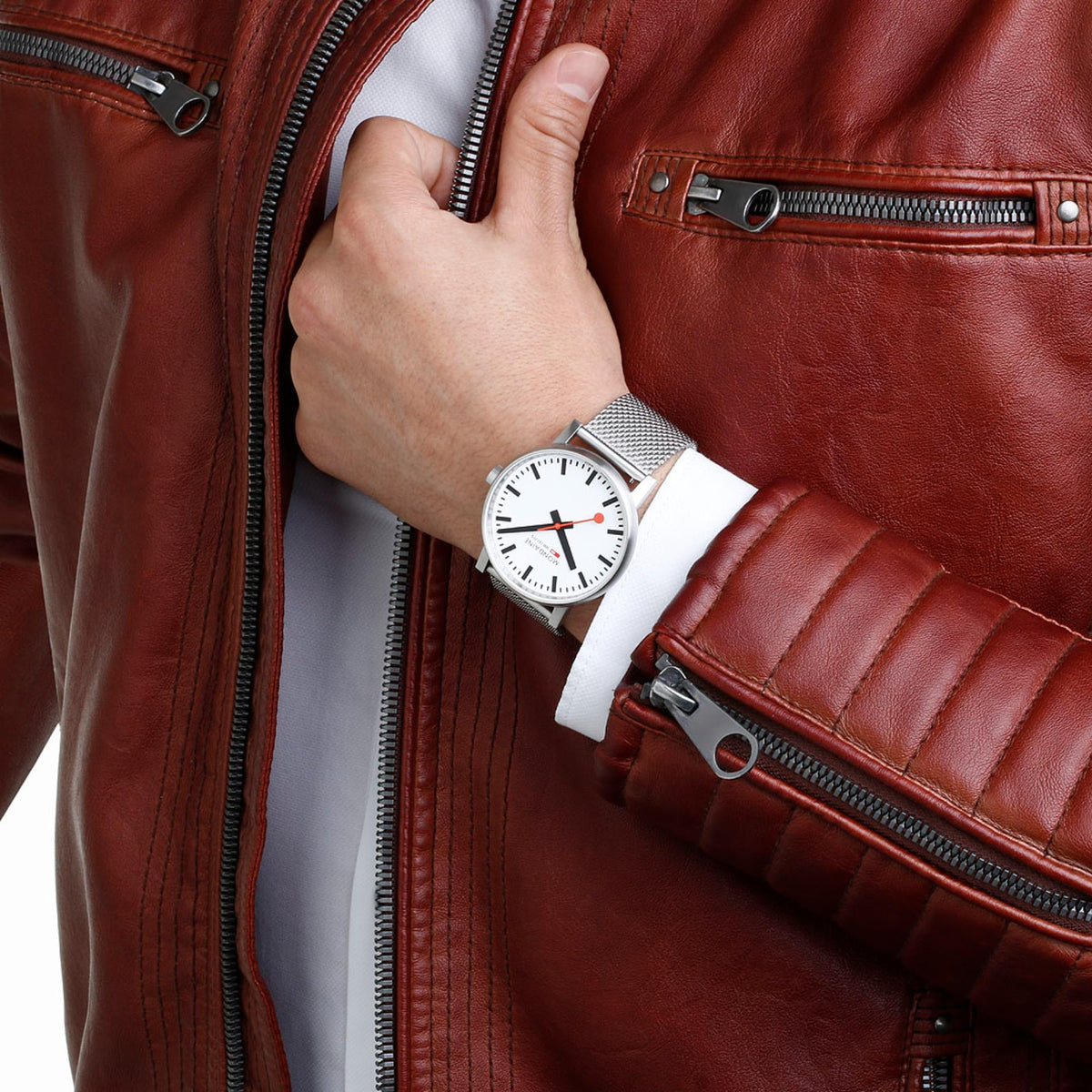 Mondaine Evo2 MSE.43110.SJ quartz timepiece styled on a wrist paired with a brown leather jacket