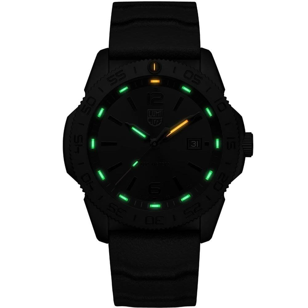 Diver watch with black dial glowing green markers, date window, black rubber strap