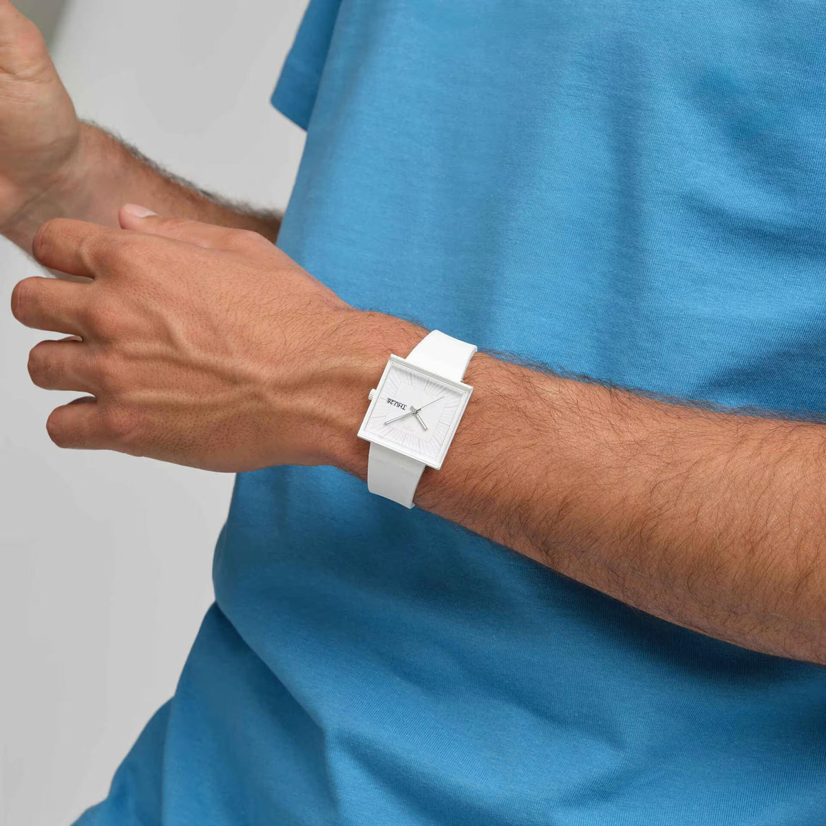 White silicone strap quartz watch on wrist