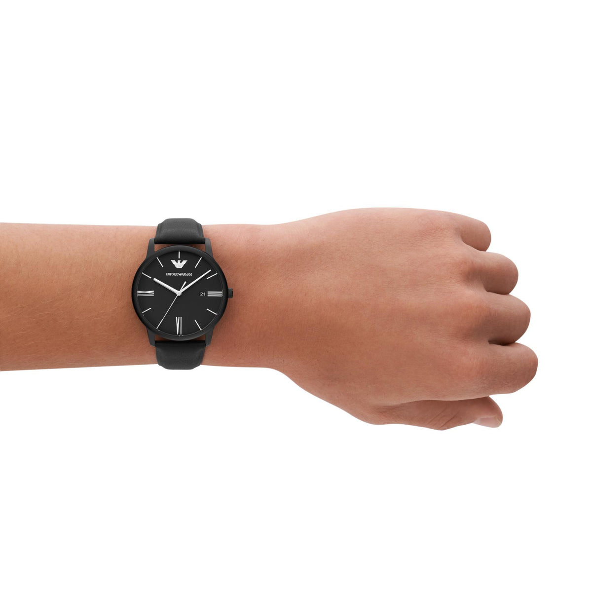 Men's black leather quartz wristwatch worn on wrist with black dial