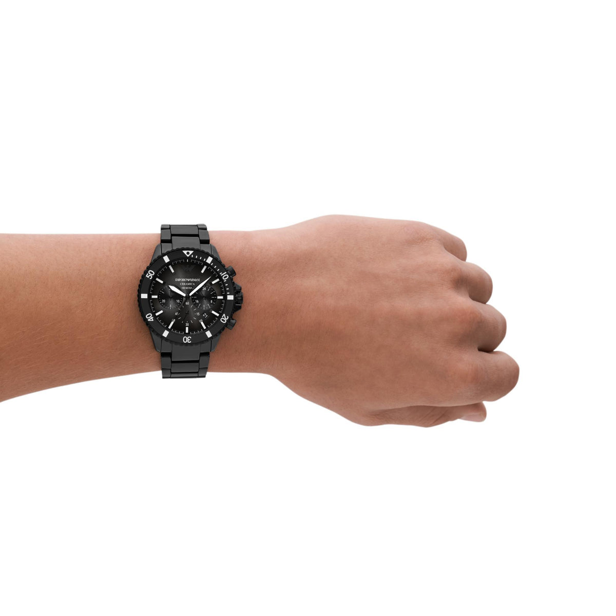 Men's black dial chronograph watch on wrist with black metal bracelet