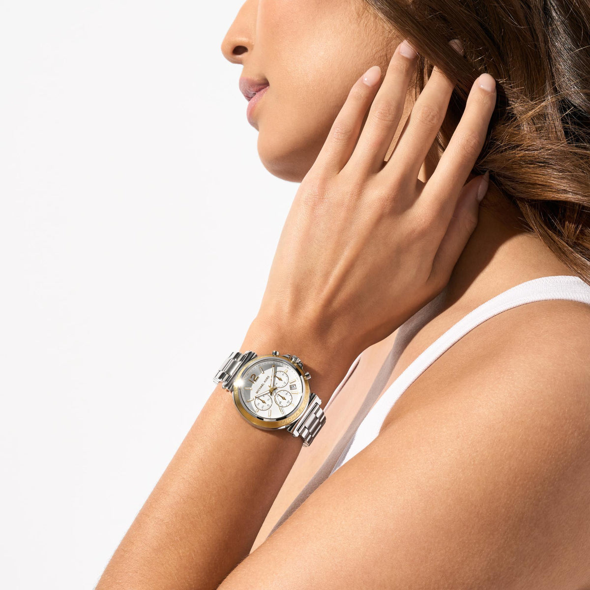 Michael Kors Maren MK7495 lifestyle shot showing women's white dial chronograph watch worn on wrist