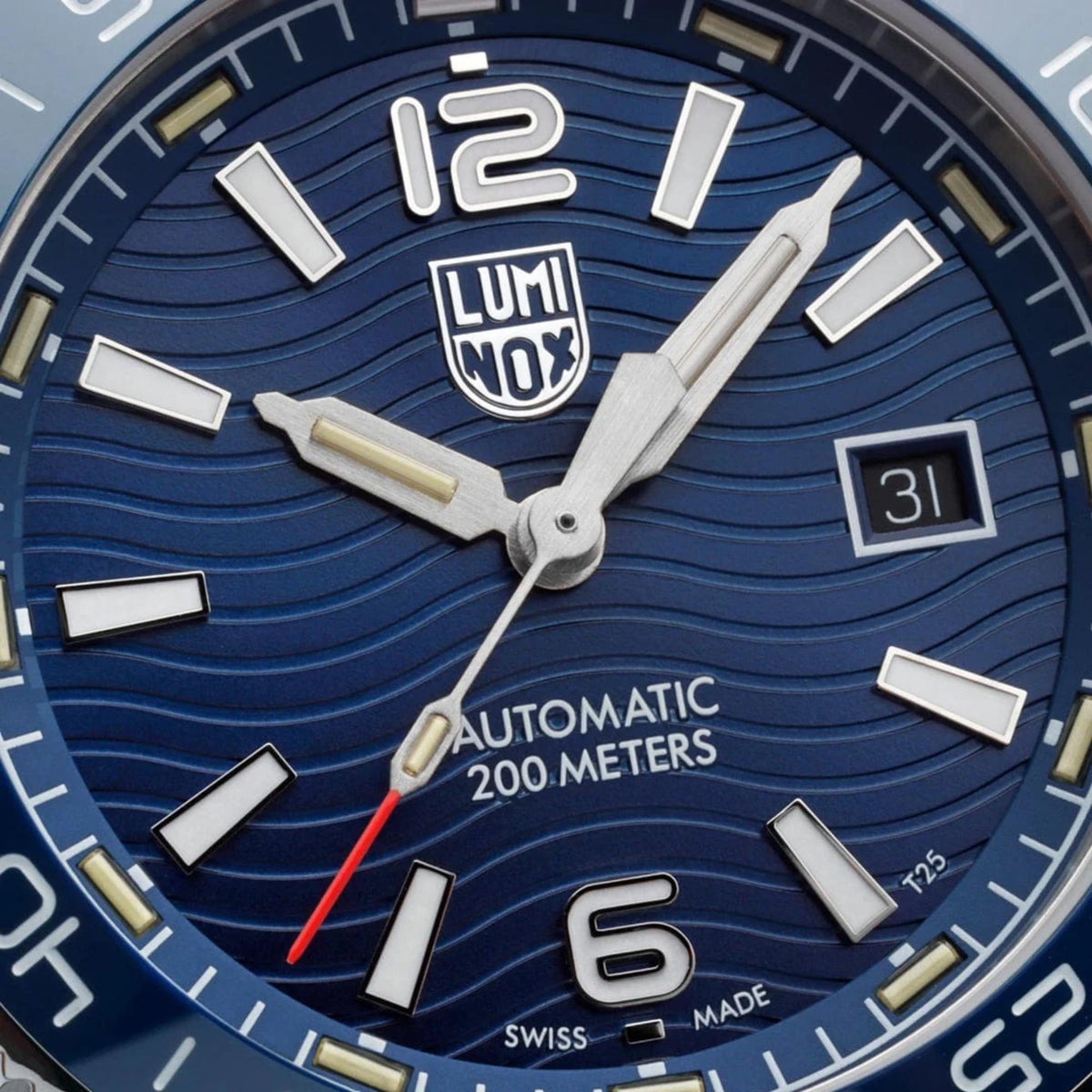Blue dial dive watch with large luminous hour markers, date window, and LUMINOX logo