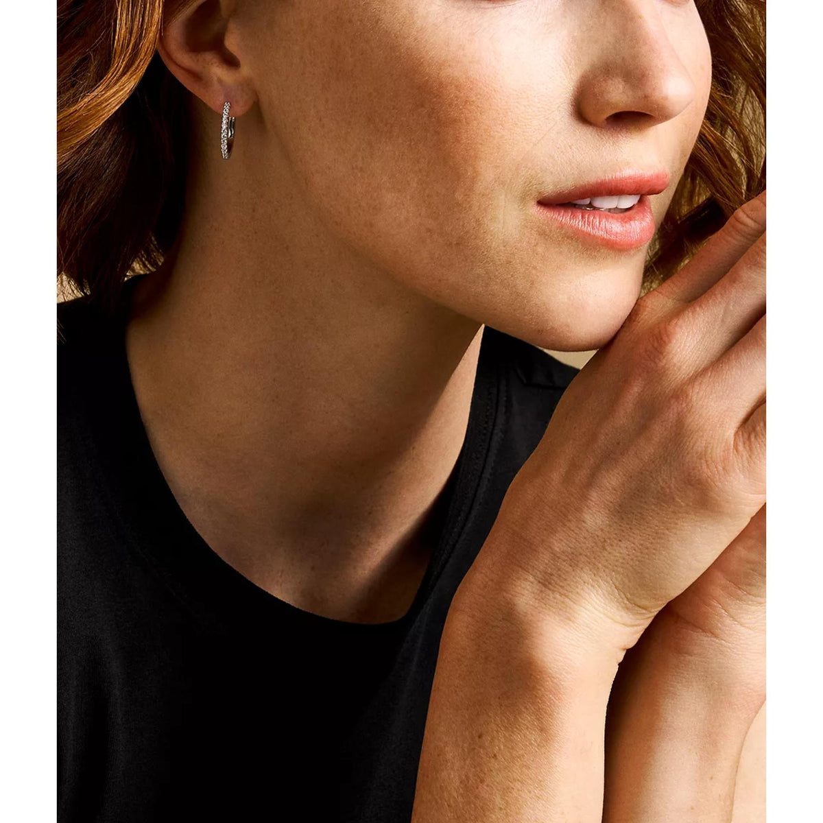 Fossil Ellis pavé glitz silver-tone brass hoop earring on model's ear