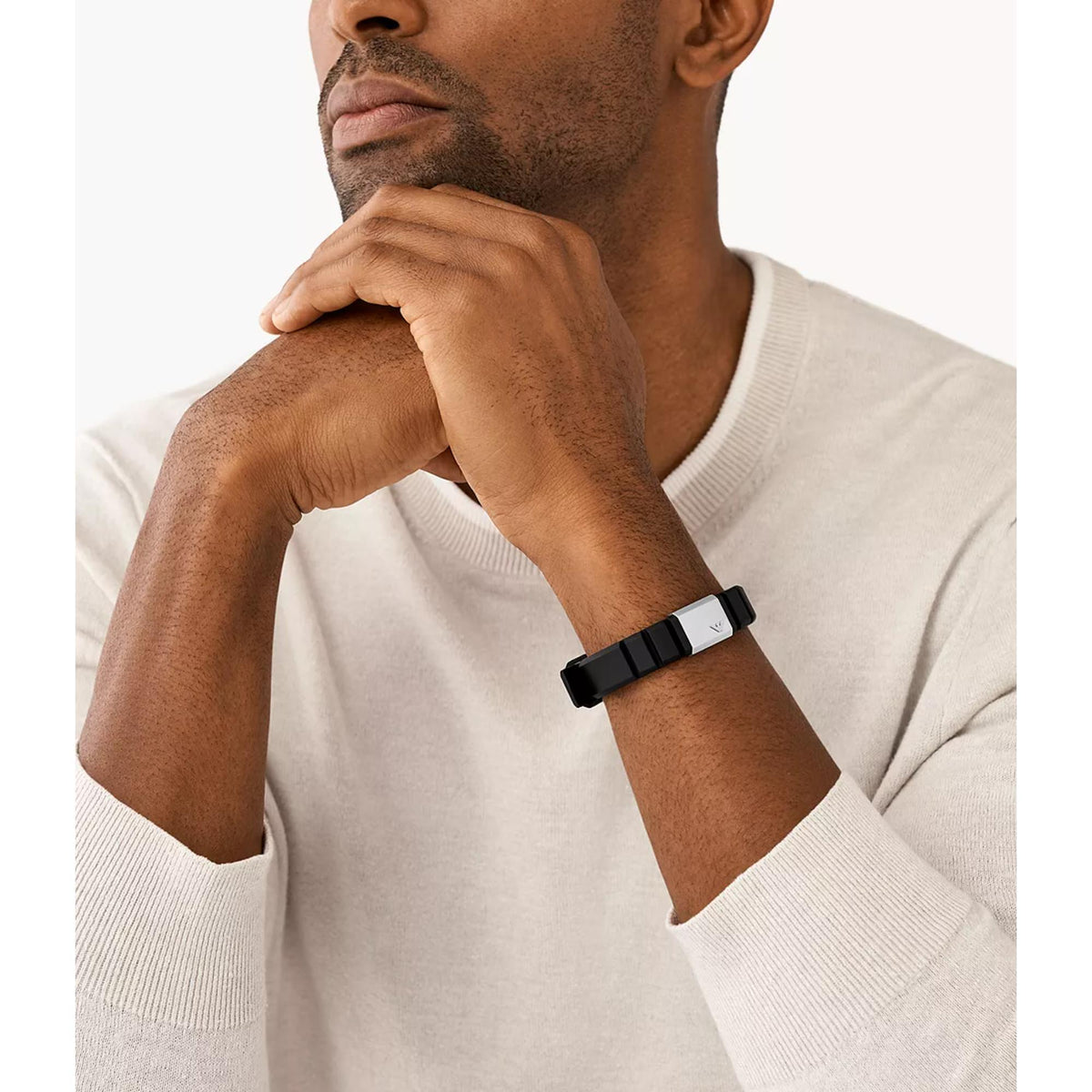 Black silicone ID bracelet worn on wrist with rectangular stainless steel clasp