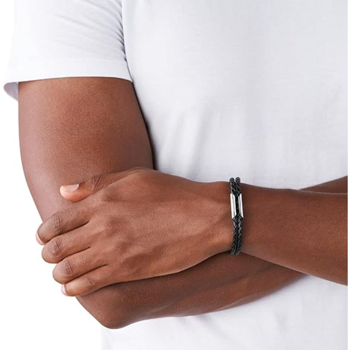 Black braided leather bracelet on wrist with silver clasp
