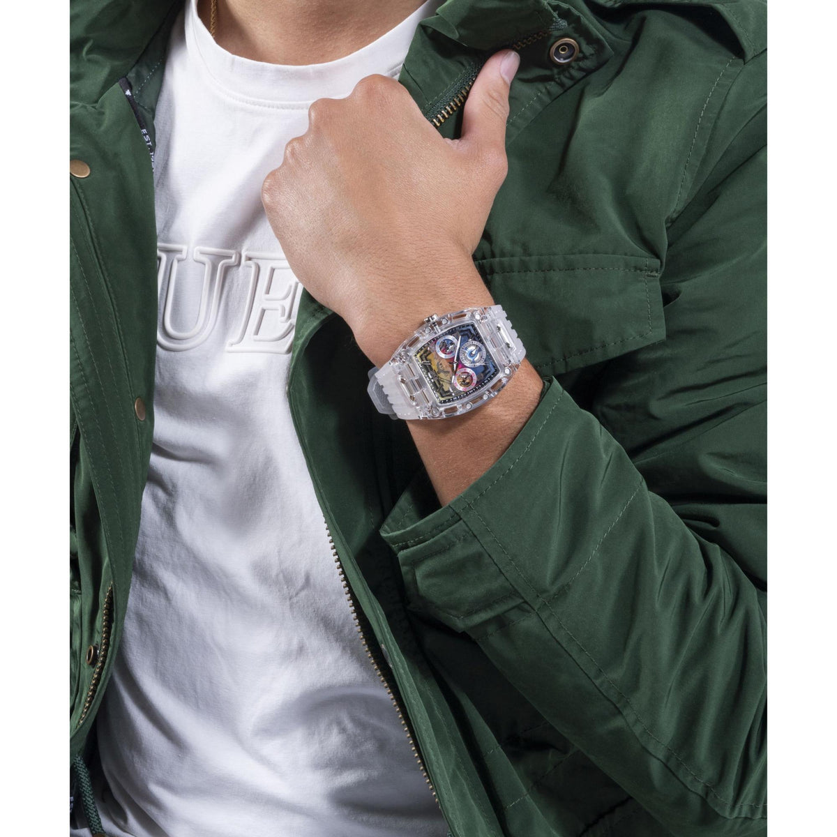 Men’s clear multifunction watch on wrist with transparent band, rectangular multi-dial face