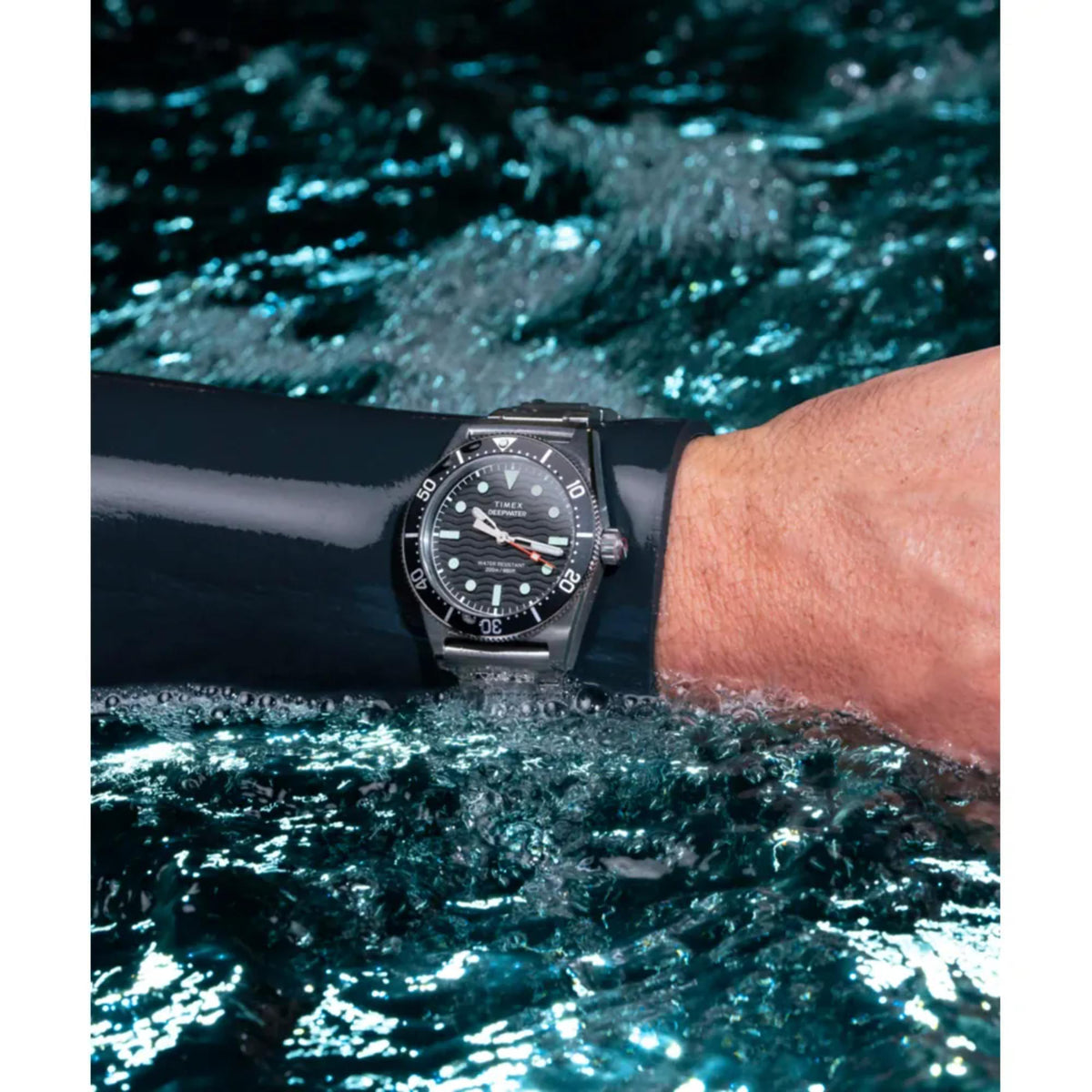 Men's Timex quartz dive watch with black dial, steel case and bezel, worn on wrist