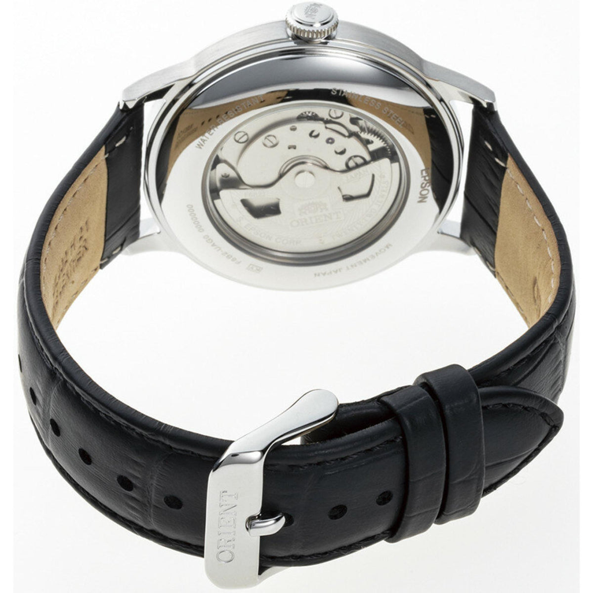 Orient Bambino RA-AK0701S30B watch showing a transparent exhibition case back, automatic movement rotor, and silver pin buckle
