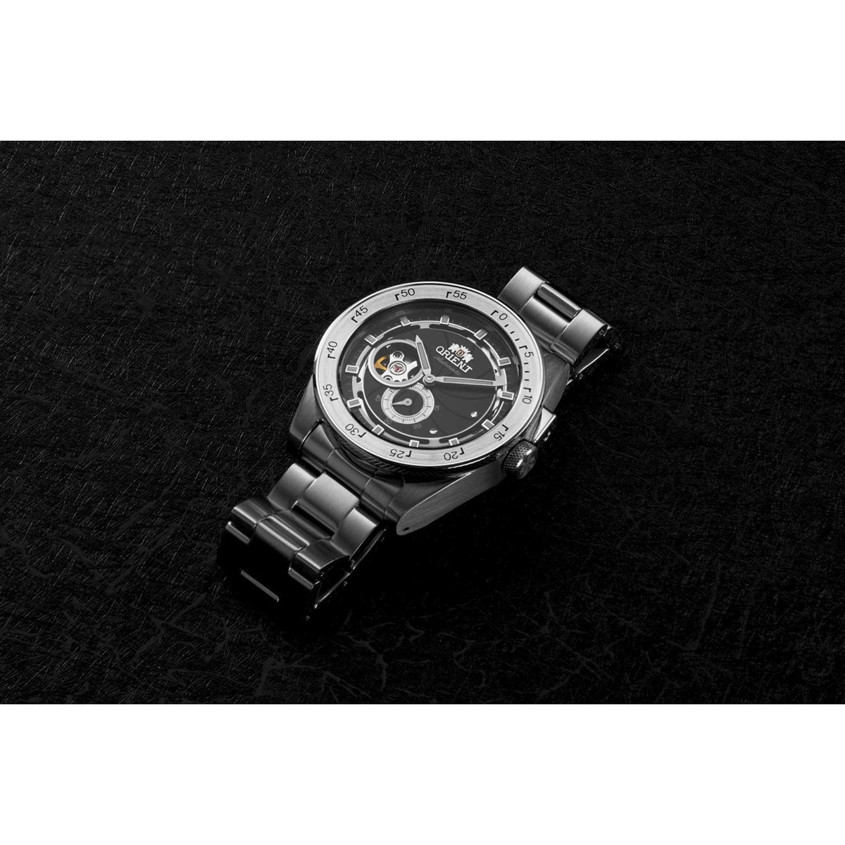 Men's steel automatic wristwatch with black dial, open-heart design, and link bracelet