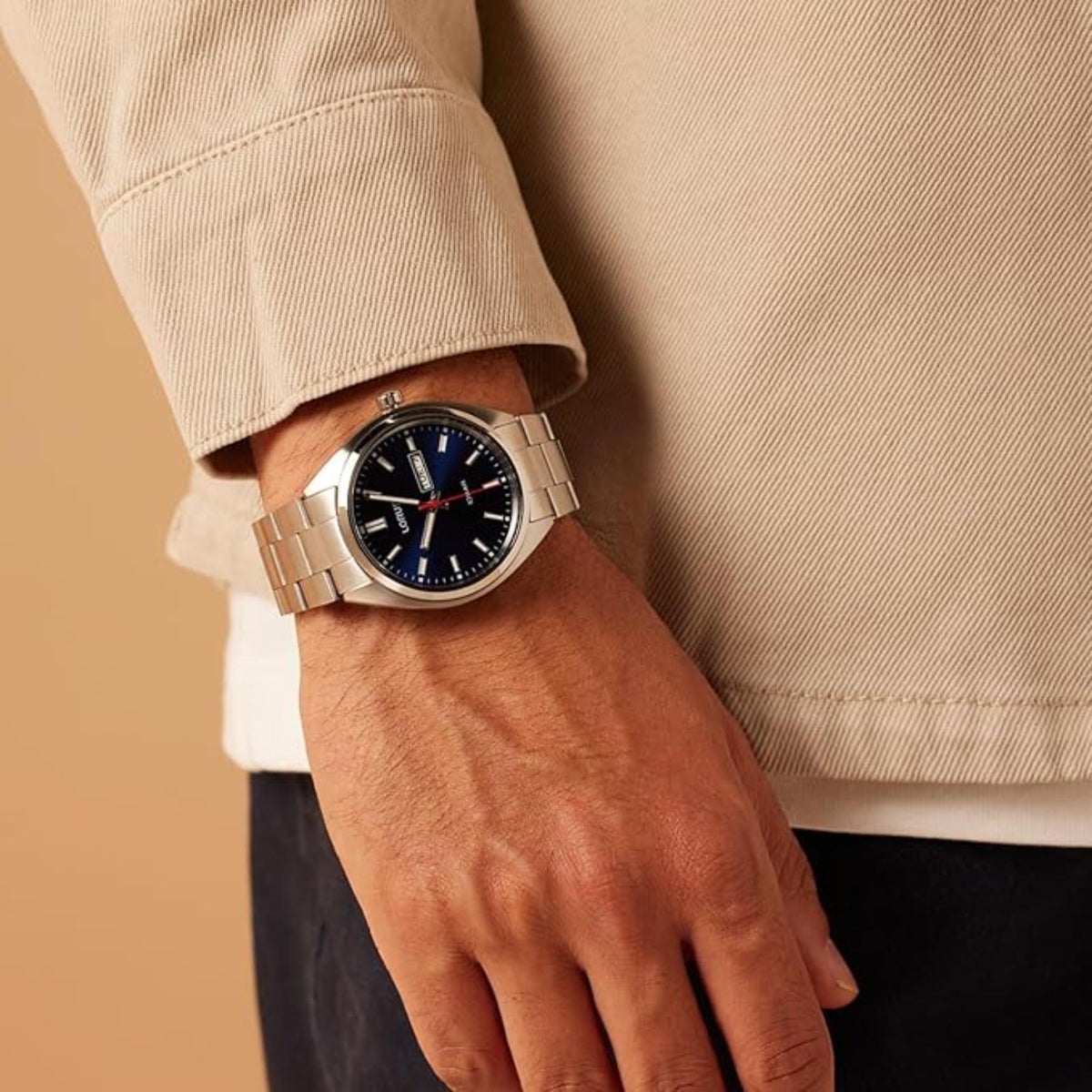 Analog quartz watch on wrist cuff, blue gradient dial and steel link bracelet