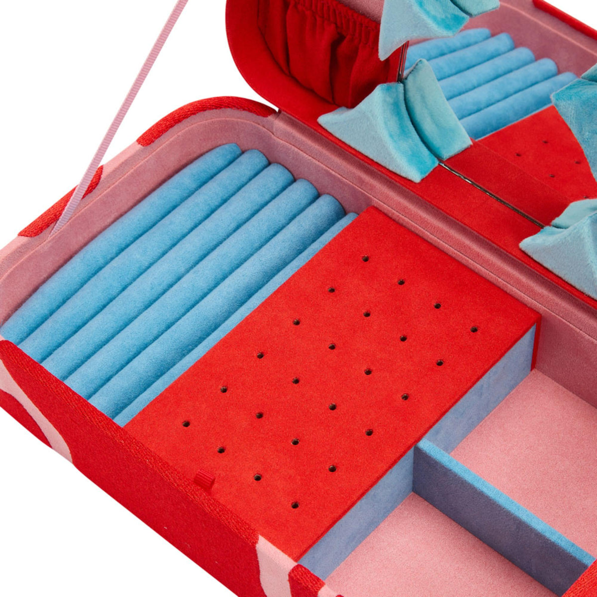 Medium jewelry box interior close-up; blue ring slots and red velvet insert with holes
