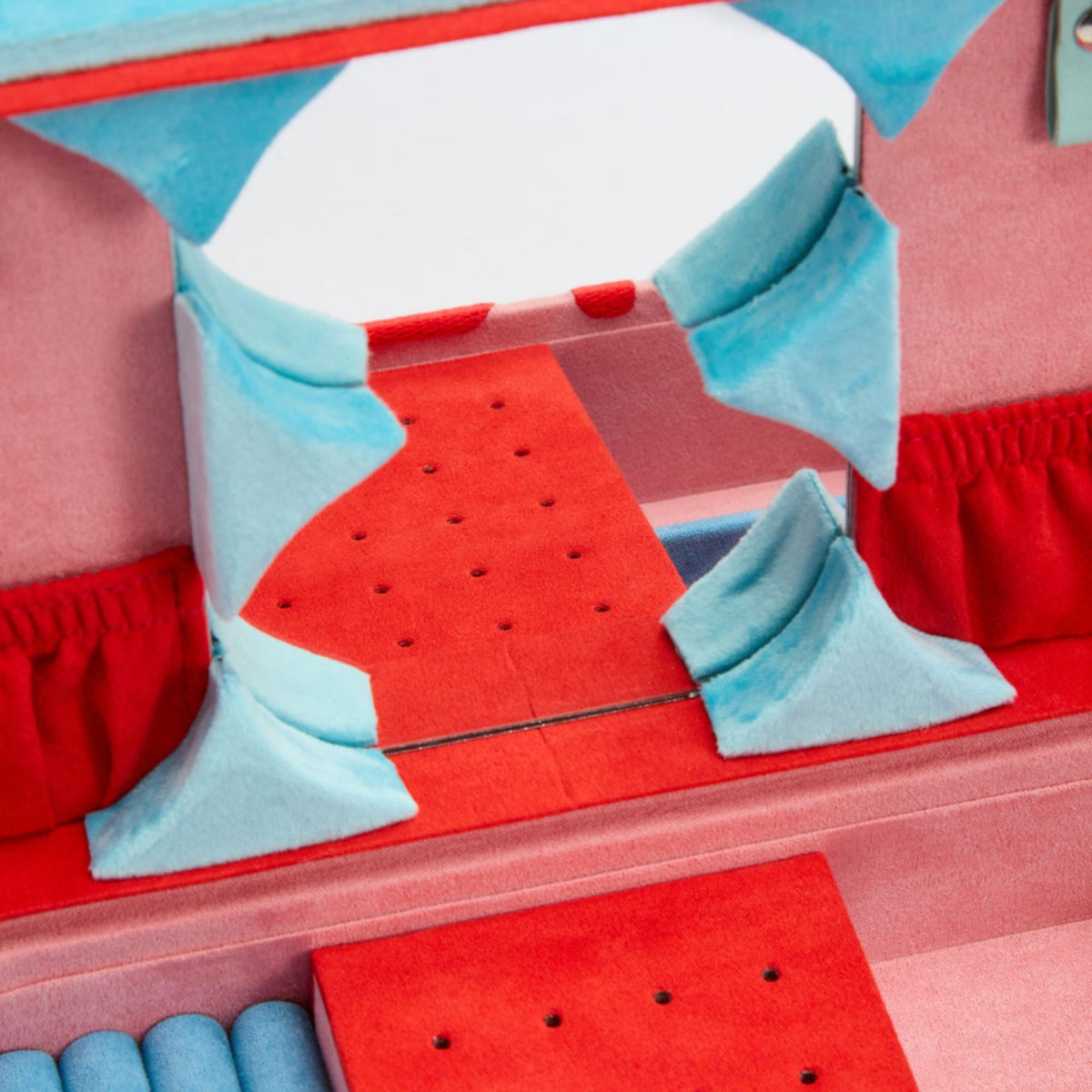 Medium jewelry box open close-up; red compartments with blue supports and cushioned inserts