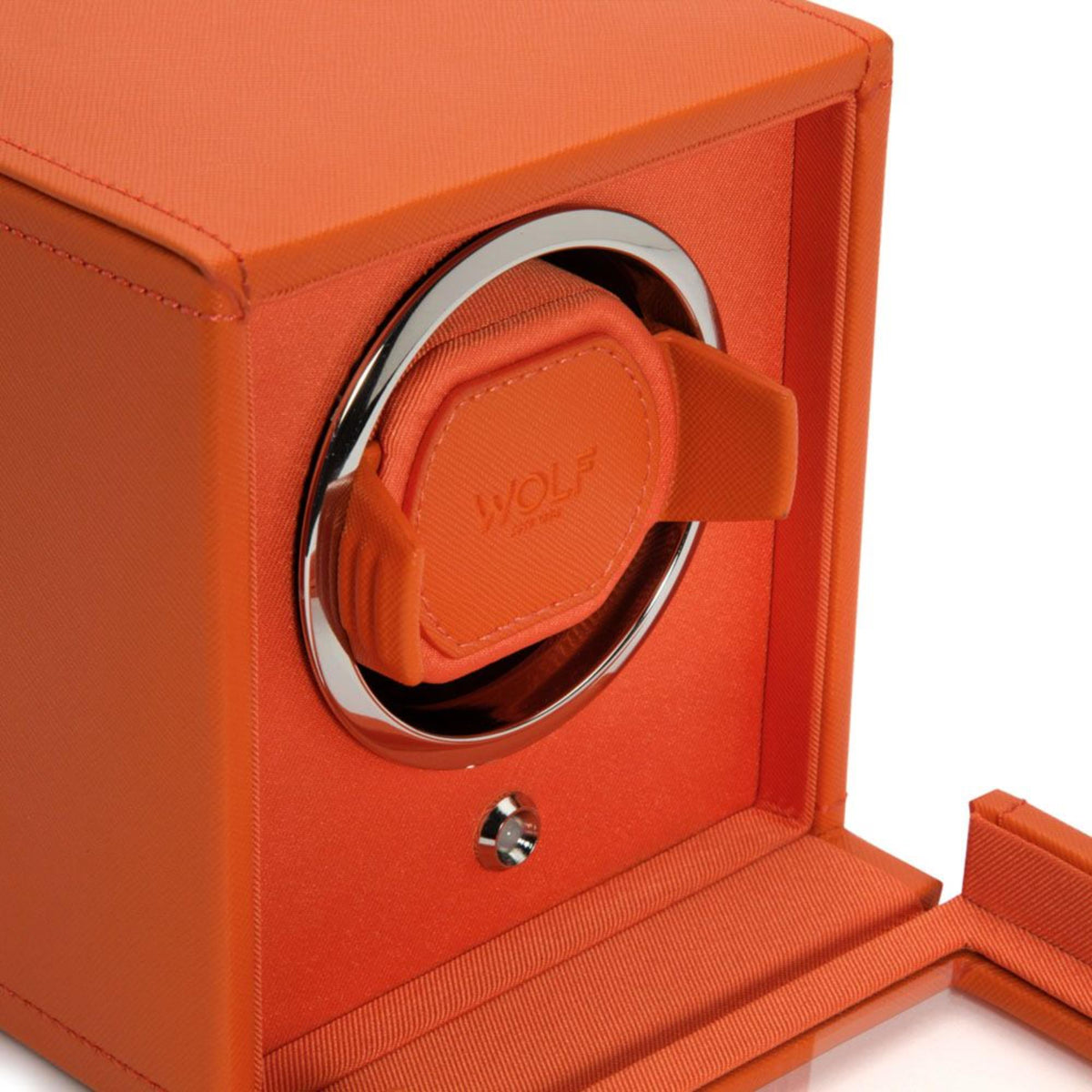 Close-up of orange watch winder rotor holder strap with WOLF logo and chrome ring