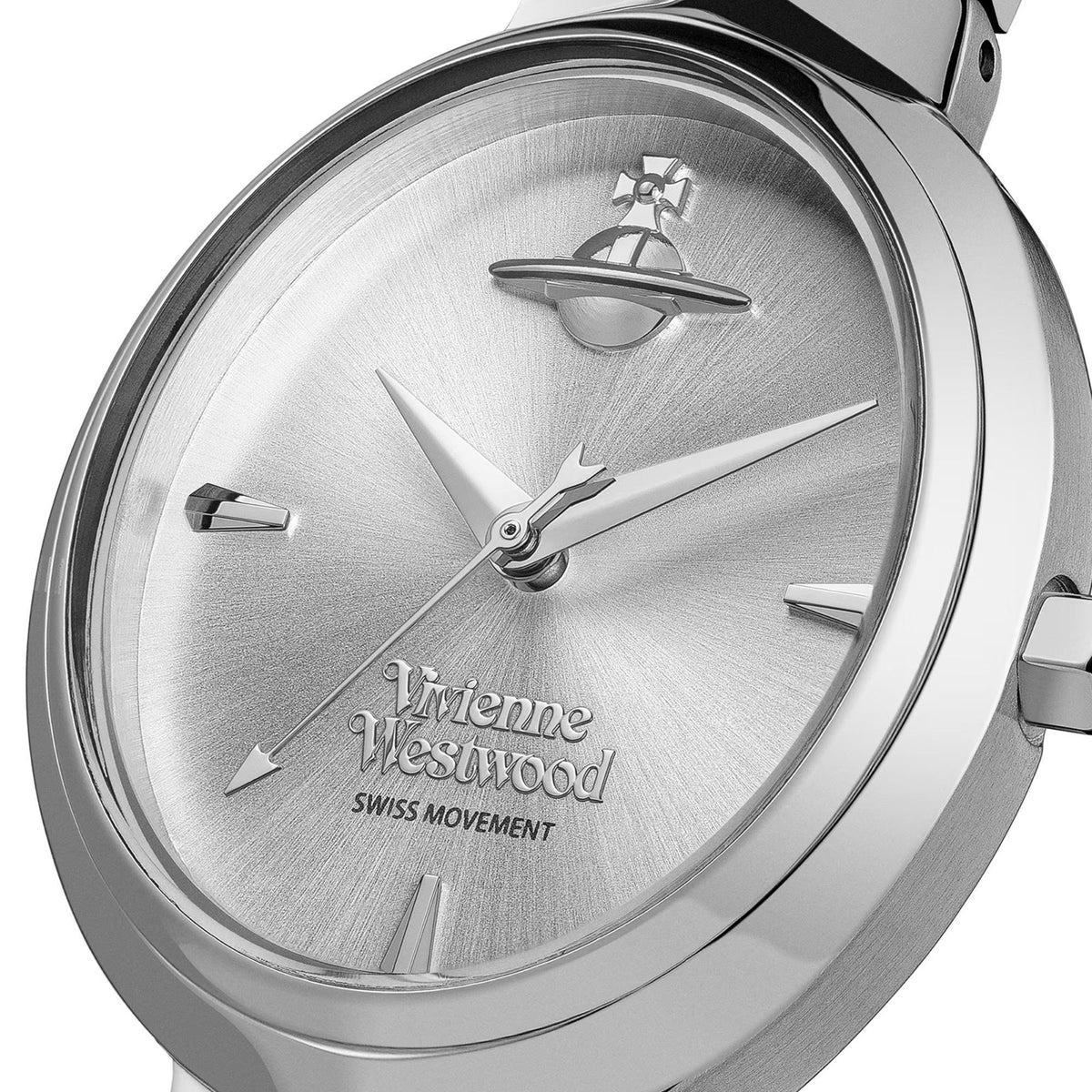 Women’s silver dial wristwatch close-up with baton hour markers, logo hands, and bezel.