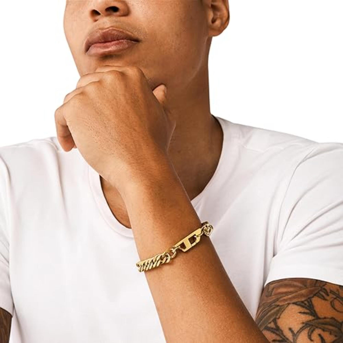 Gold-tone chain link bracelet with clasp, worn on wrist