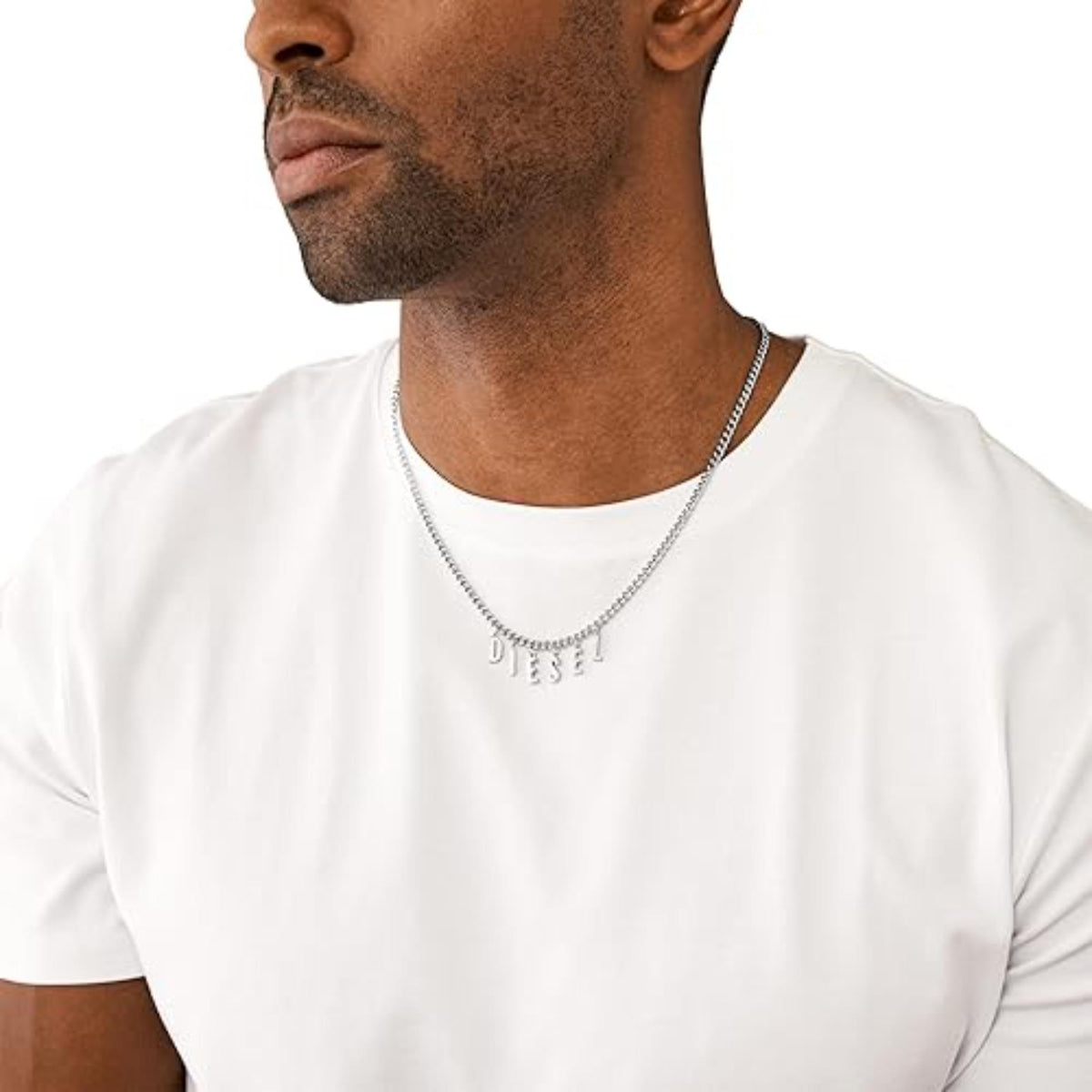 Stainless steel chain necklace with letter charms D I E S E L on a man’s neck