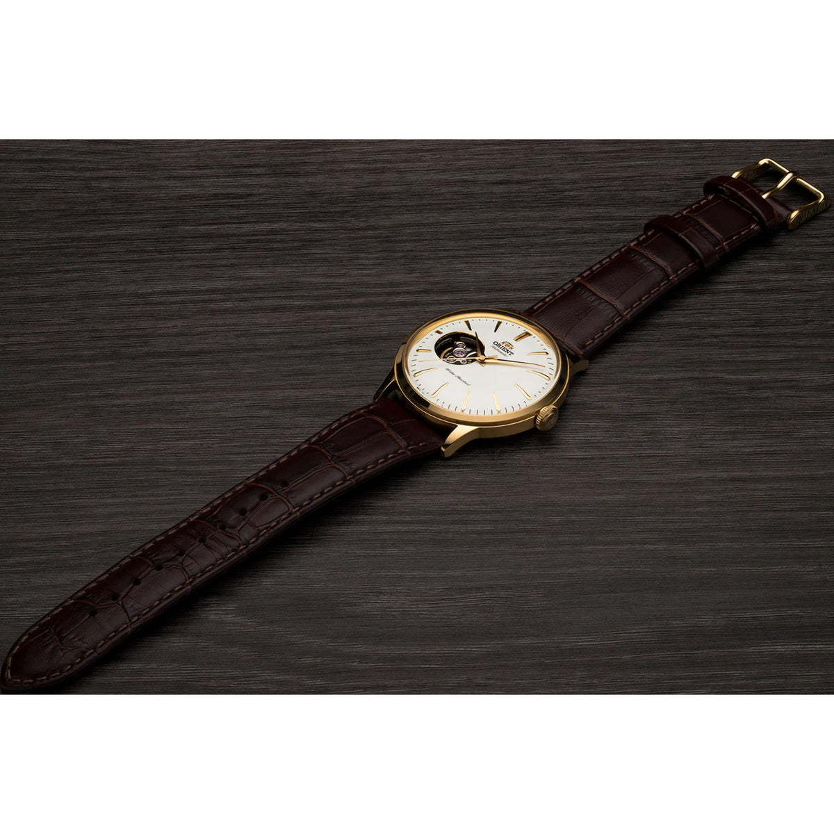 Men's automatic watch with white open-heart dial and brown leather strap, gold case