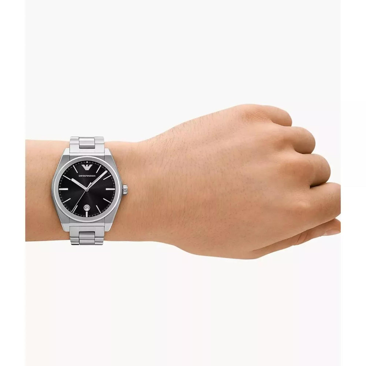 Men's steel quartz wristwatch worn on wrist with black dial and metal bracelet