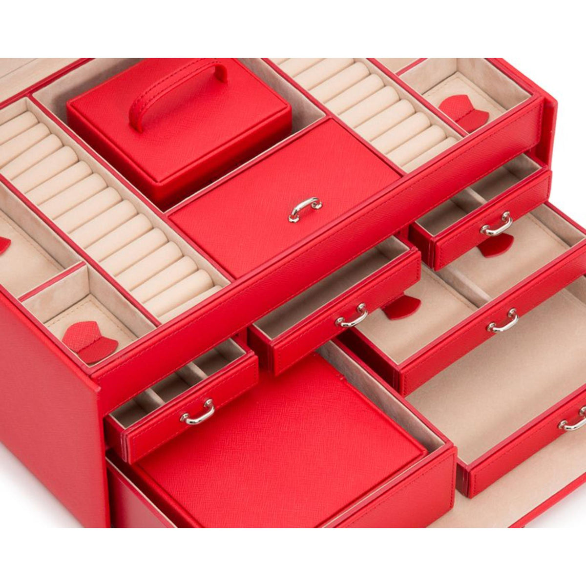 Red jewelry box interior with padded slots and open drawers with metal pulls