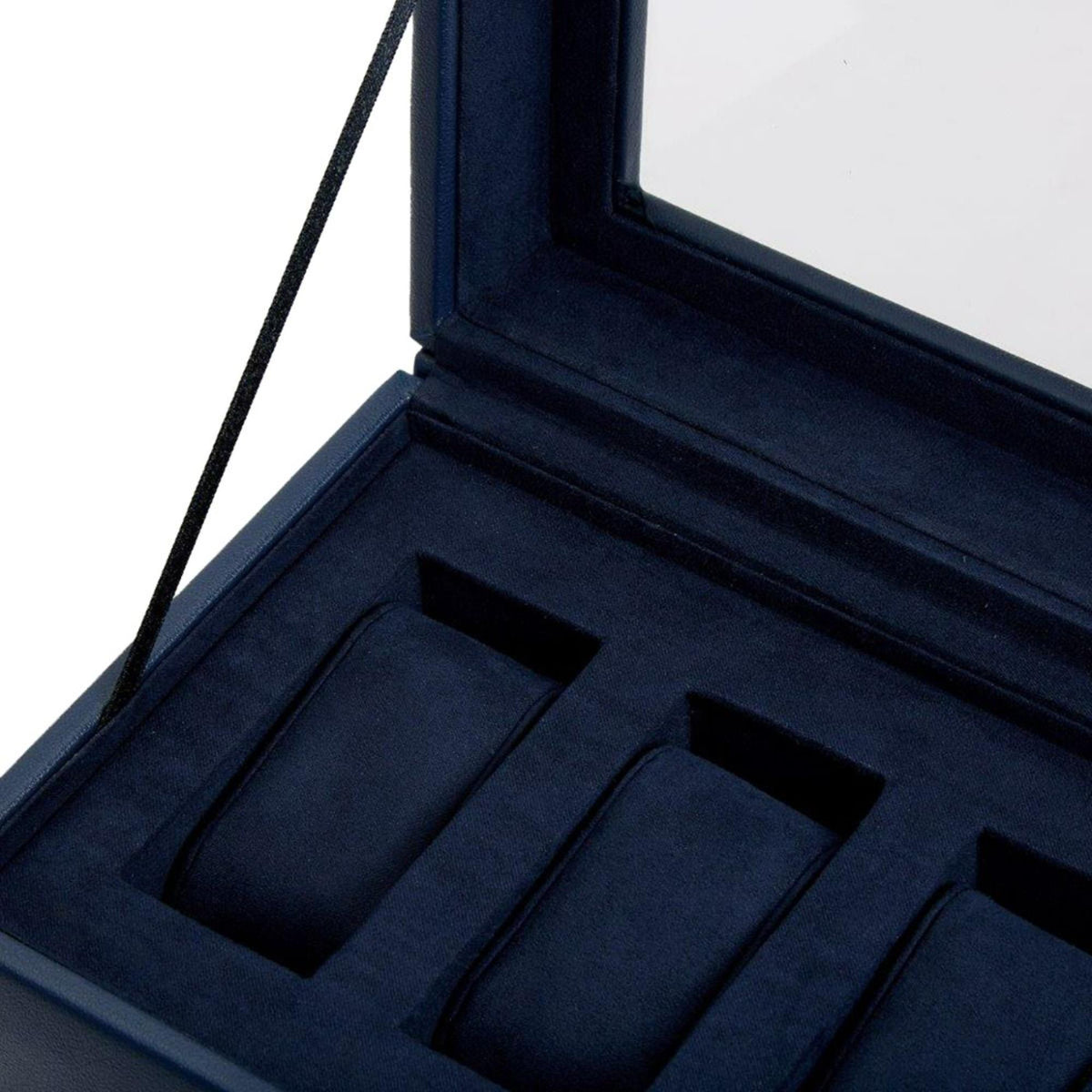 Open navy watch box interior with five padded compartments