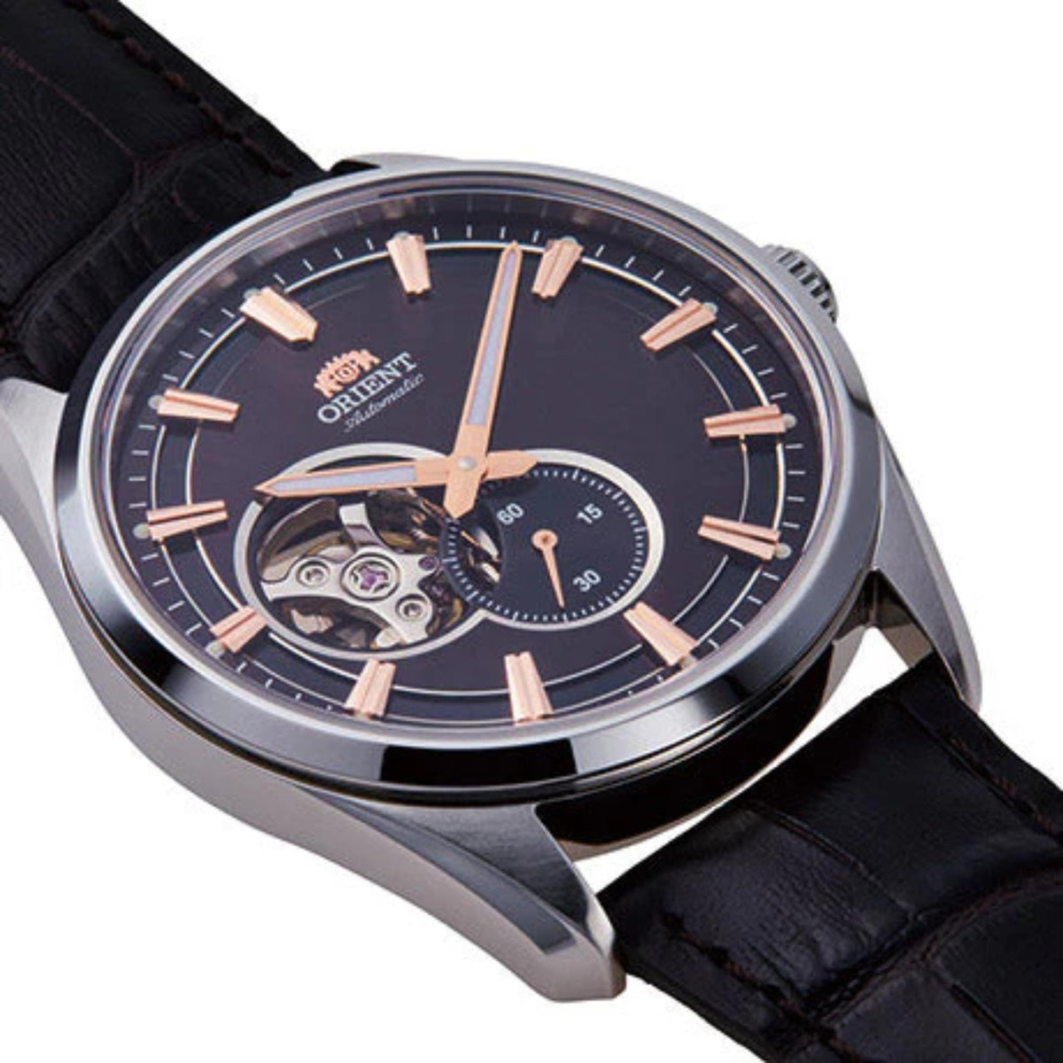 Men's automatic watch close-up: black dial with semi-skeleton movement and rose-gold markers