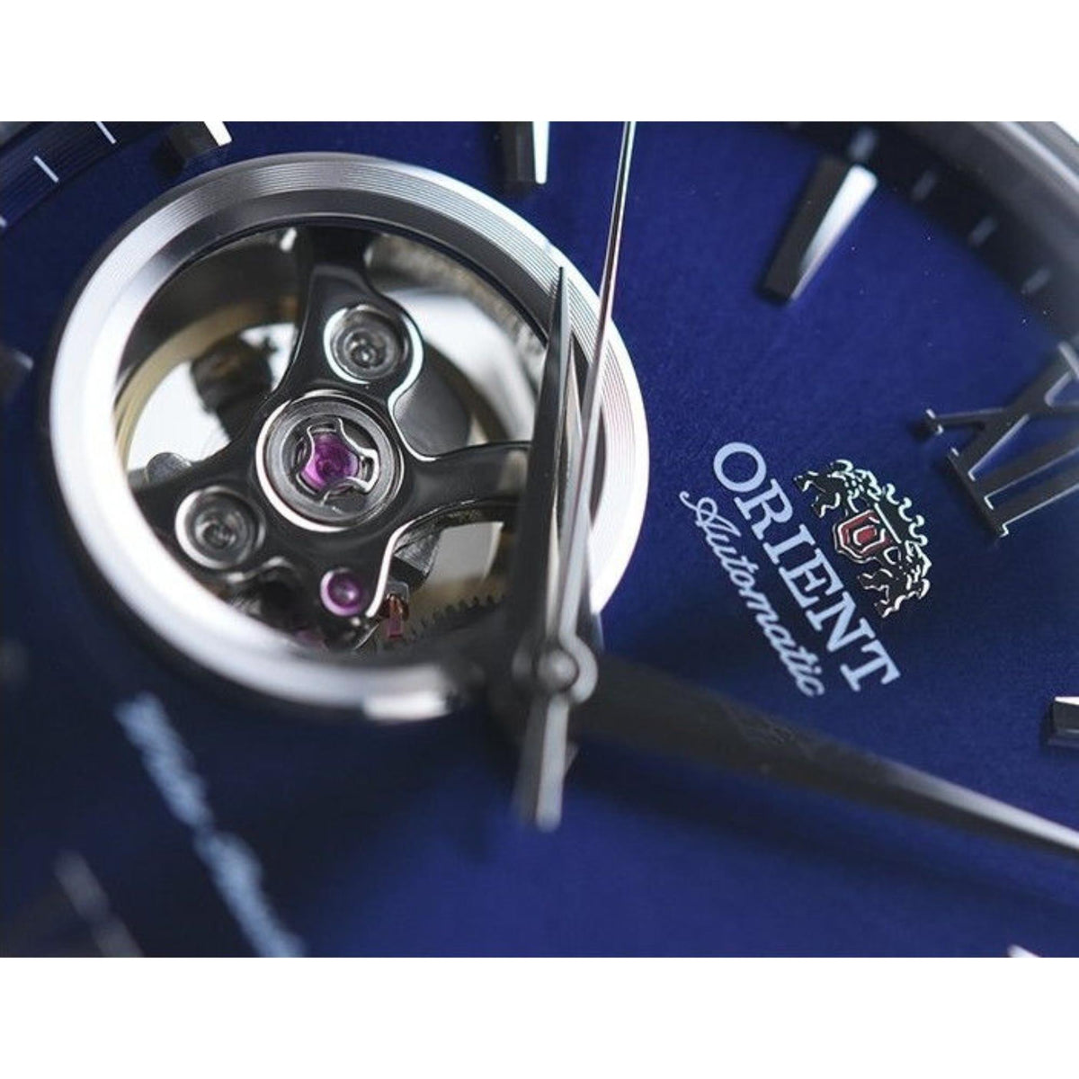 Open-heart view of Orient Contemporary blue dial automatic movement with exposed gears