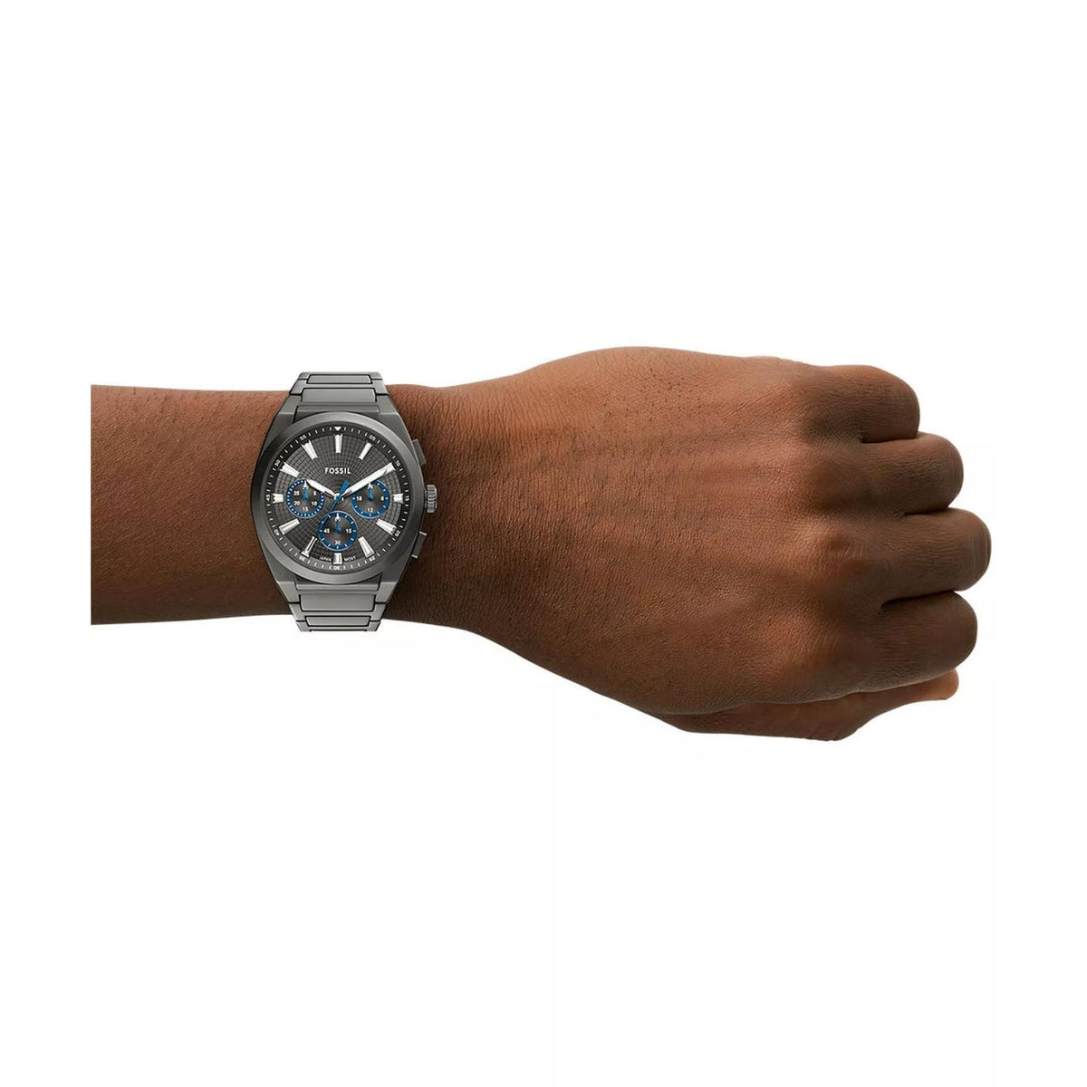 Fossil Everett FS6107 44mm wrist watch styled on arm, showcasing the grey textured dial and gunmetal stainless steel bracelet