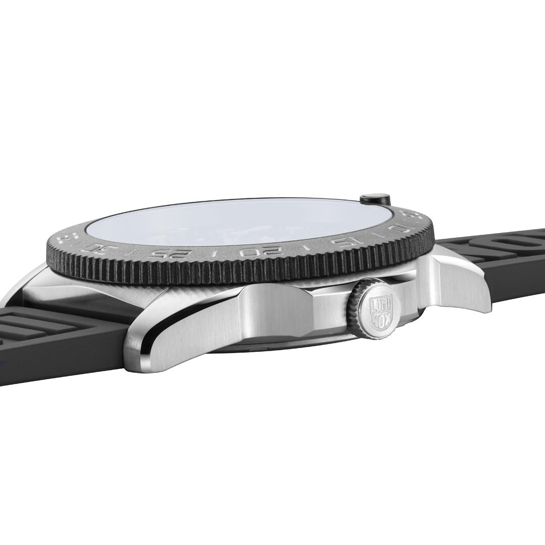 Men's diver watch close-up of case and black rubber strap with ridged bezel edge.