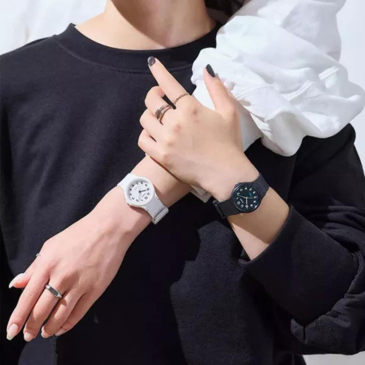 White resin strap quartz watch on wrist, white dial with Casio logo and hands