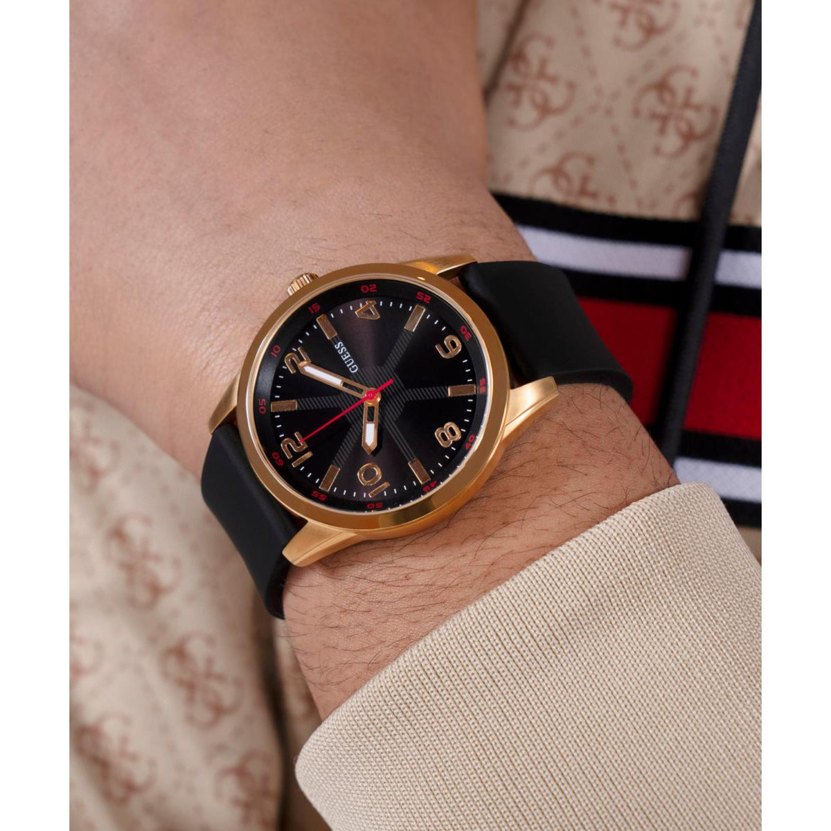 Men's wristwatch with black silicone strap and gold case, black dial with red hands