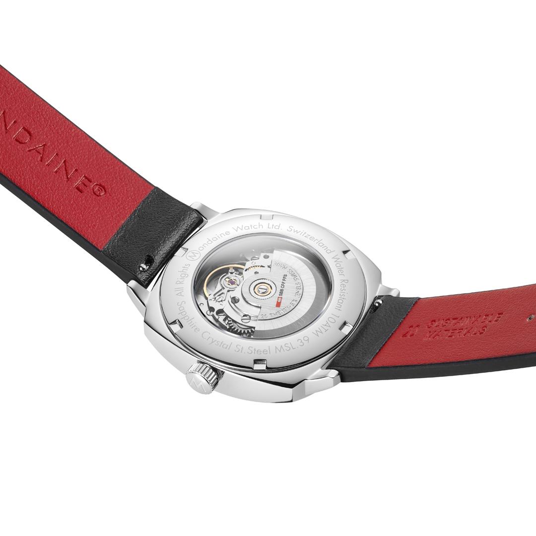 Mondaine Cushion watch showing back view with red leather underside and silver crown