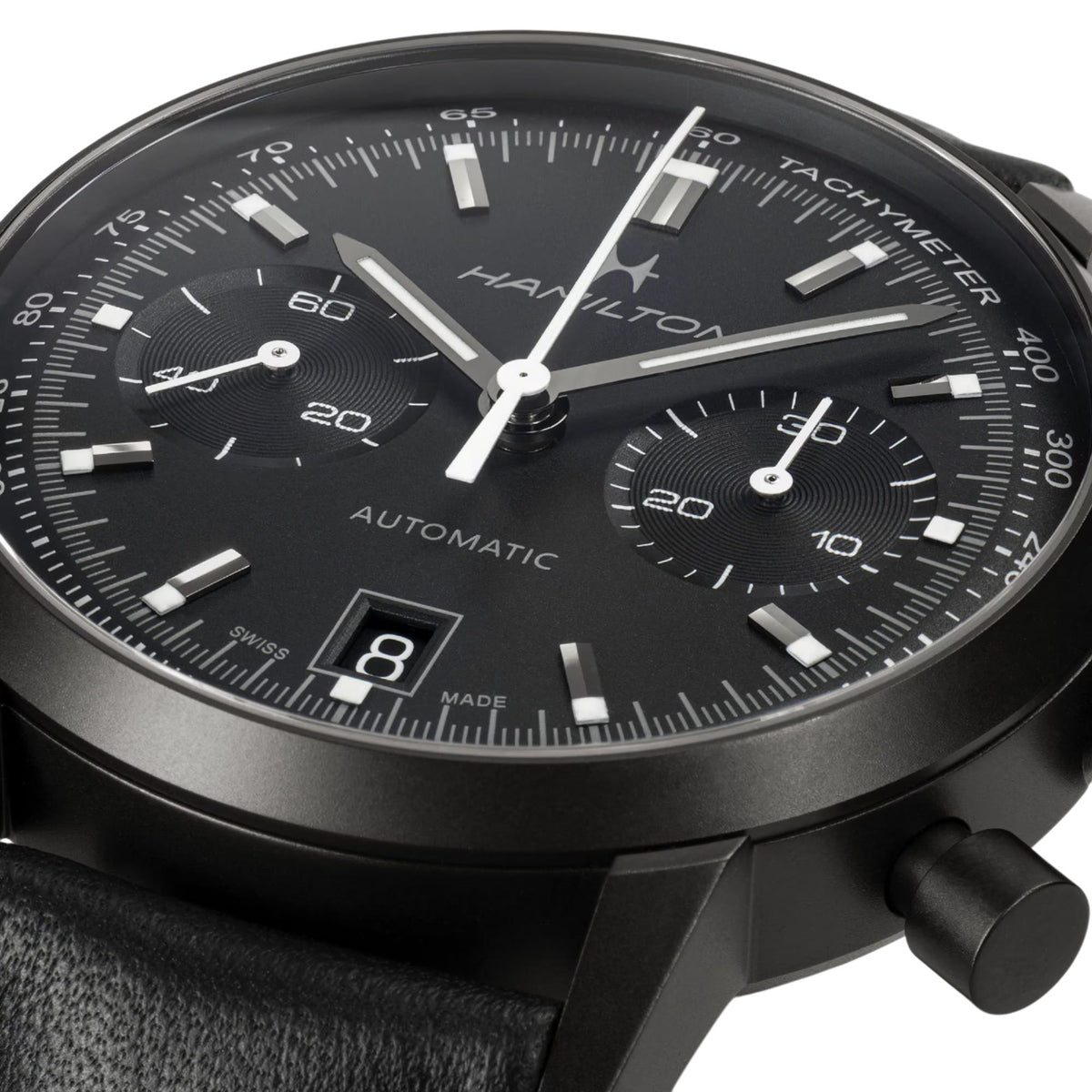 Black dial chronograph watch with tachymeter bezel, three subdials and pushers