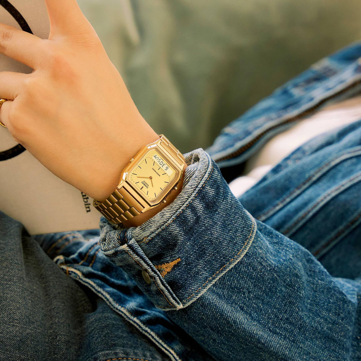 Casio Collection Vintage AQ-230GA-9DMQYES on wrist, showcasing the classic square gold case design and integrated steel strap