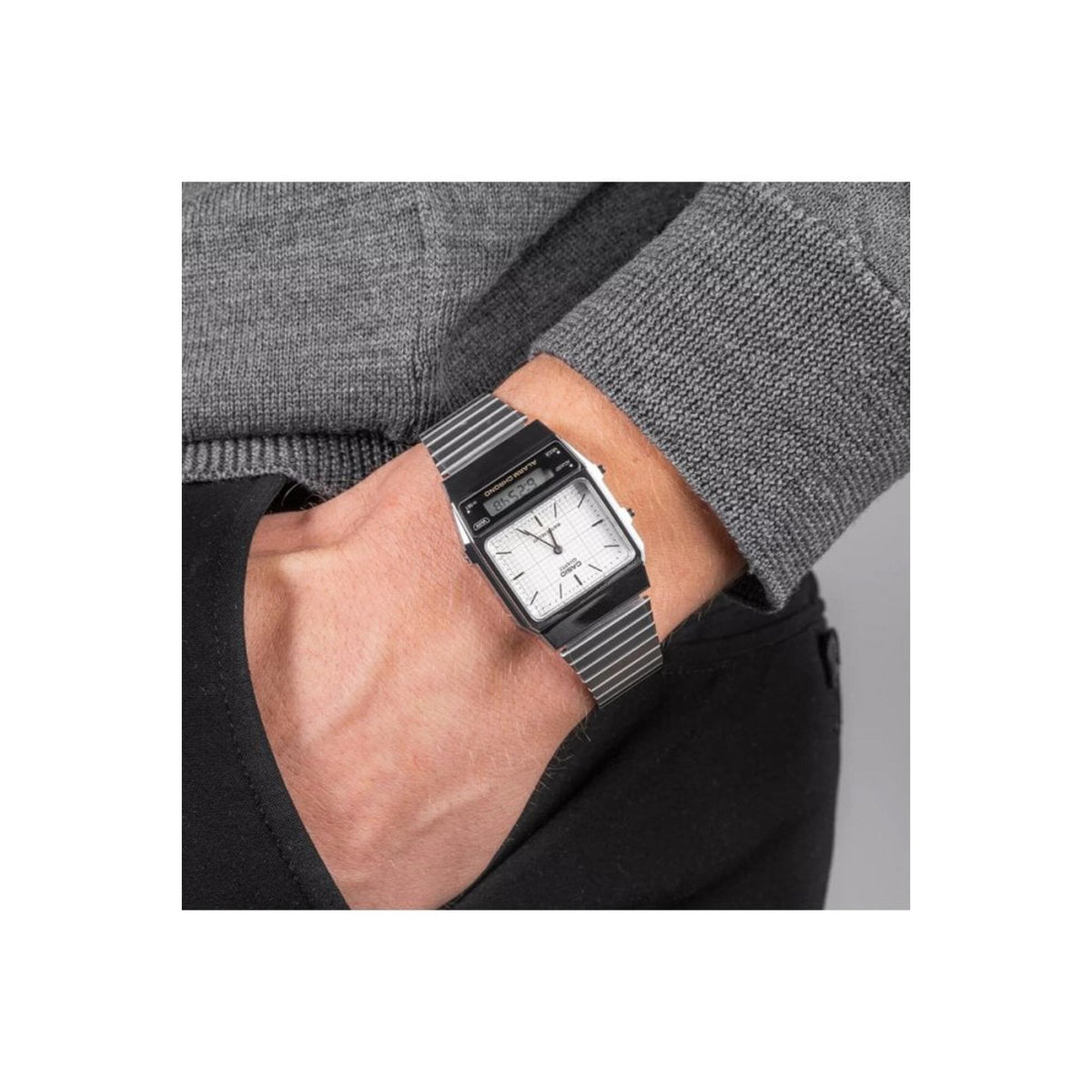 Casio Vintage Edgy AQ-800E-7AEF steel watch displayed on a wrist with a grey sweater sleeve