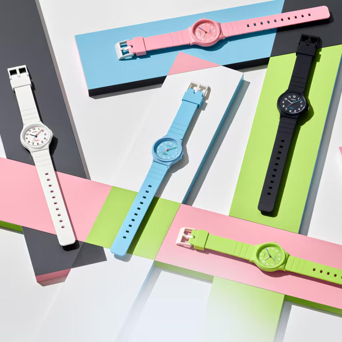 Assorted colorful resin strap analog watches on display with round dials