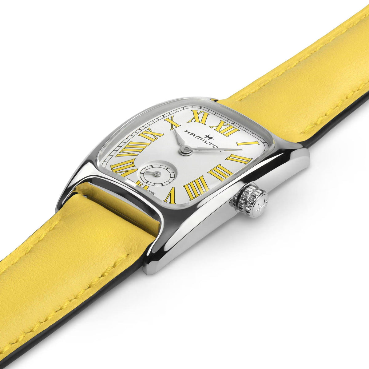 Quartz watch detail, white dial with Roman numerals, yellow leather strap, silver crown