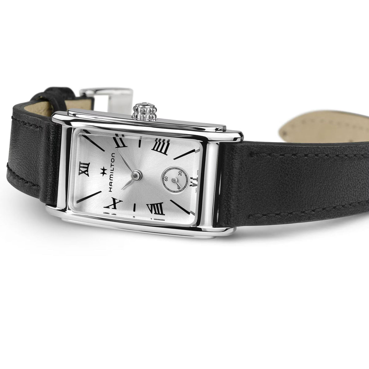 Ladies quartz watch on a dark leather strap with silver case and white dial, roman numerals.