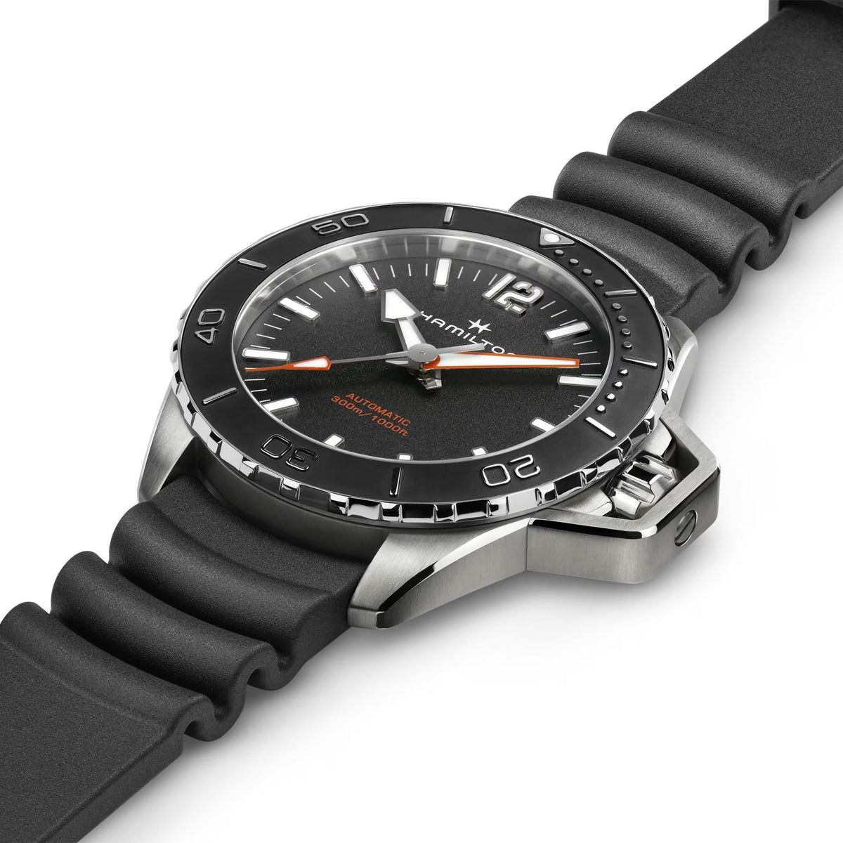 Automatic dive-style watch with black dial, black rubber strap, and stainless steel bezel