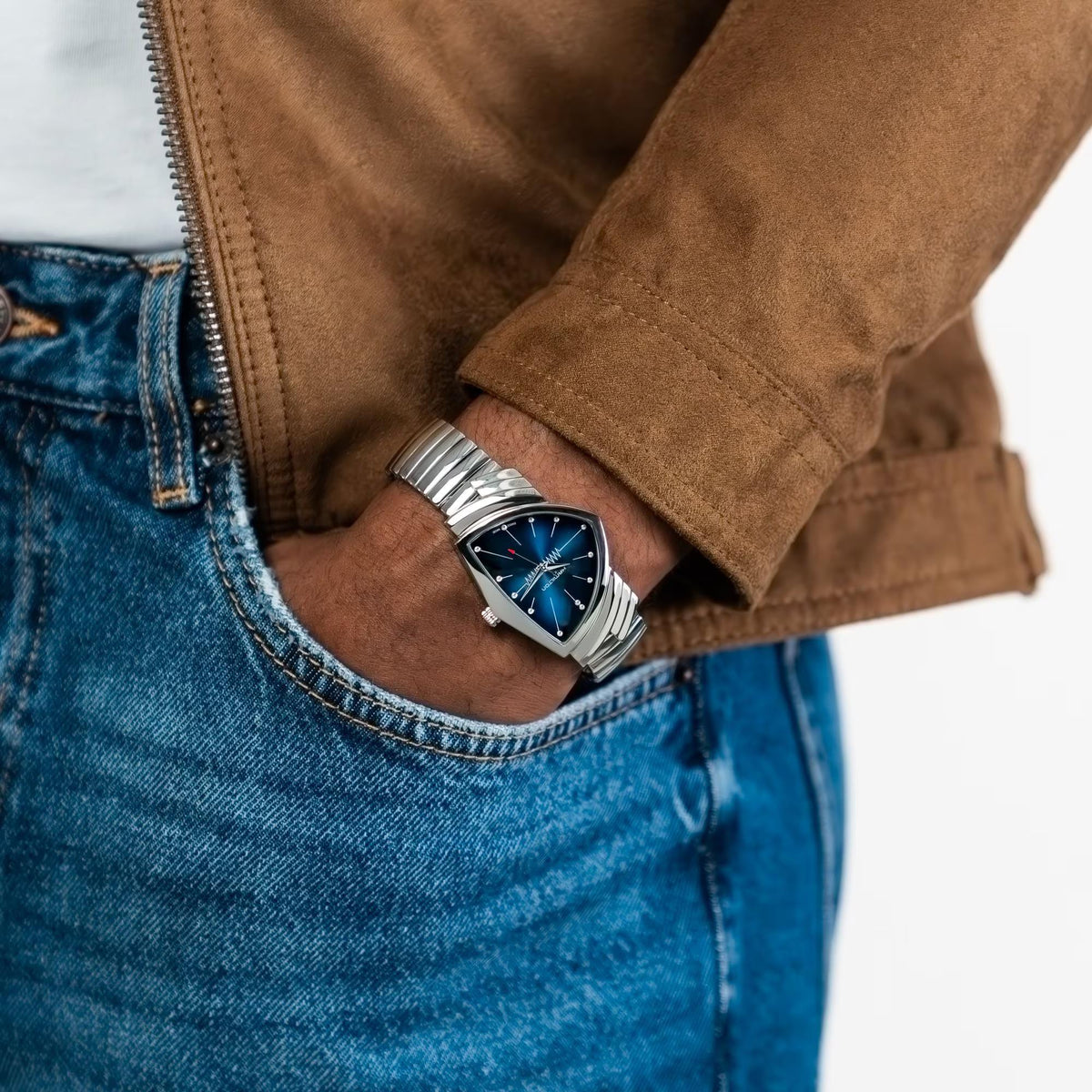 Hamilton Ventura steel quartz watch on wrist, blue dial, ribbed stainless bracelet.