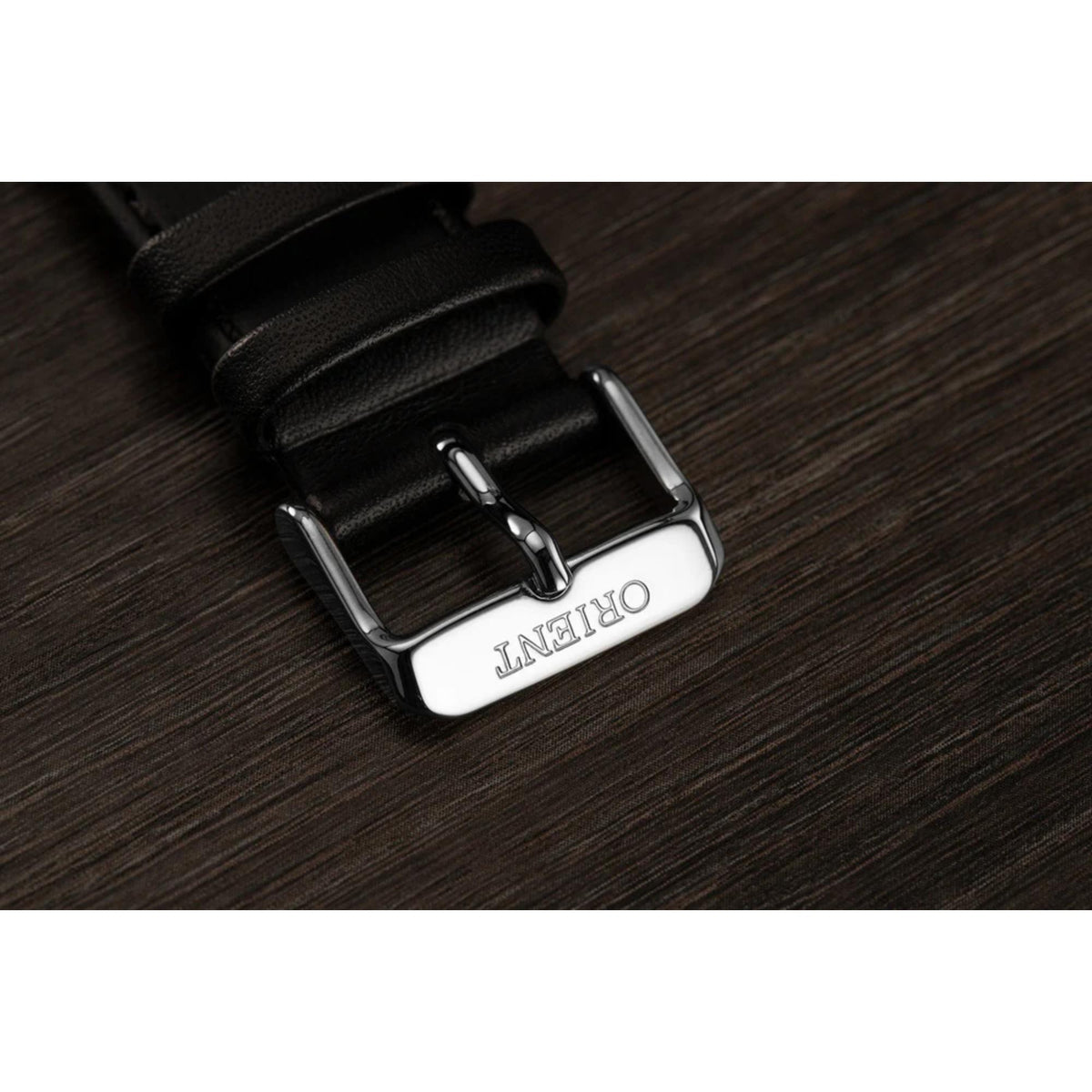 Black leather watch strap with silver-tone buckle and stitched detailing