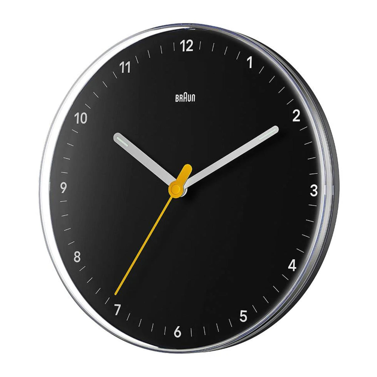 Black wall clock with chrome rim and yellow hands over a black dial