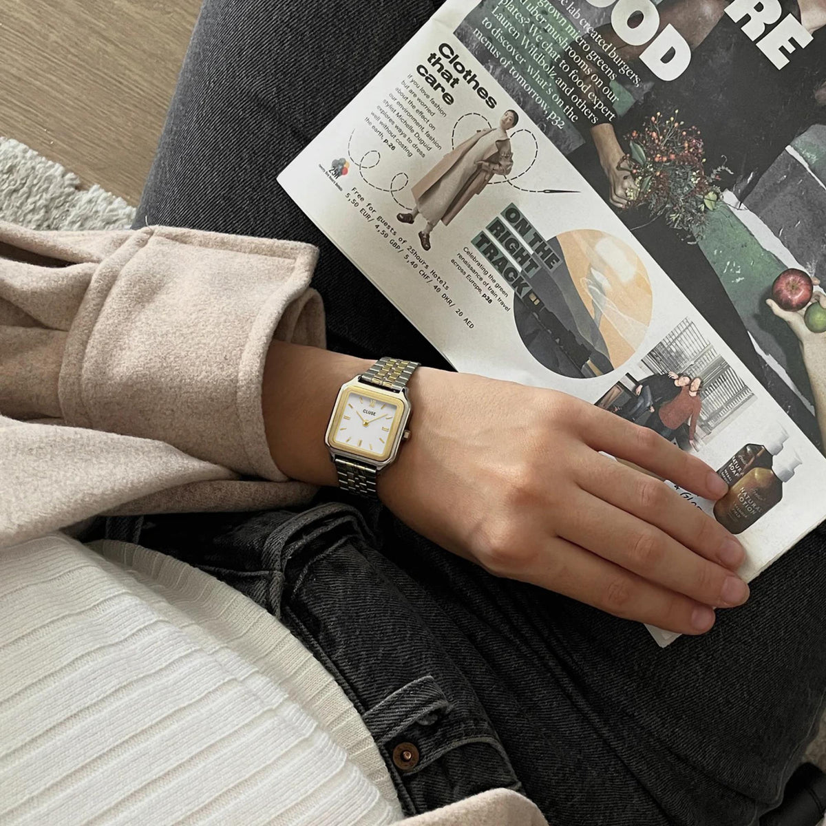 CLUSE women’s quartz watch with white dial and gold/steel bracelet on wrist