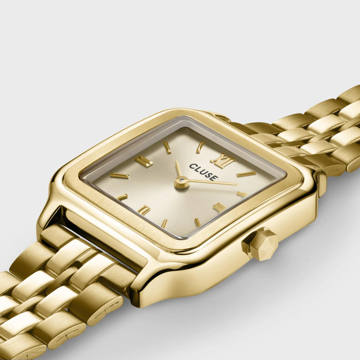 Gold-tone square quartz watch with white dial, stick markers, and metal bracelet strap