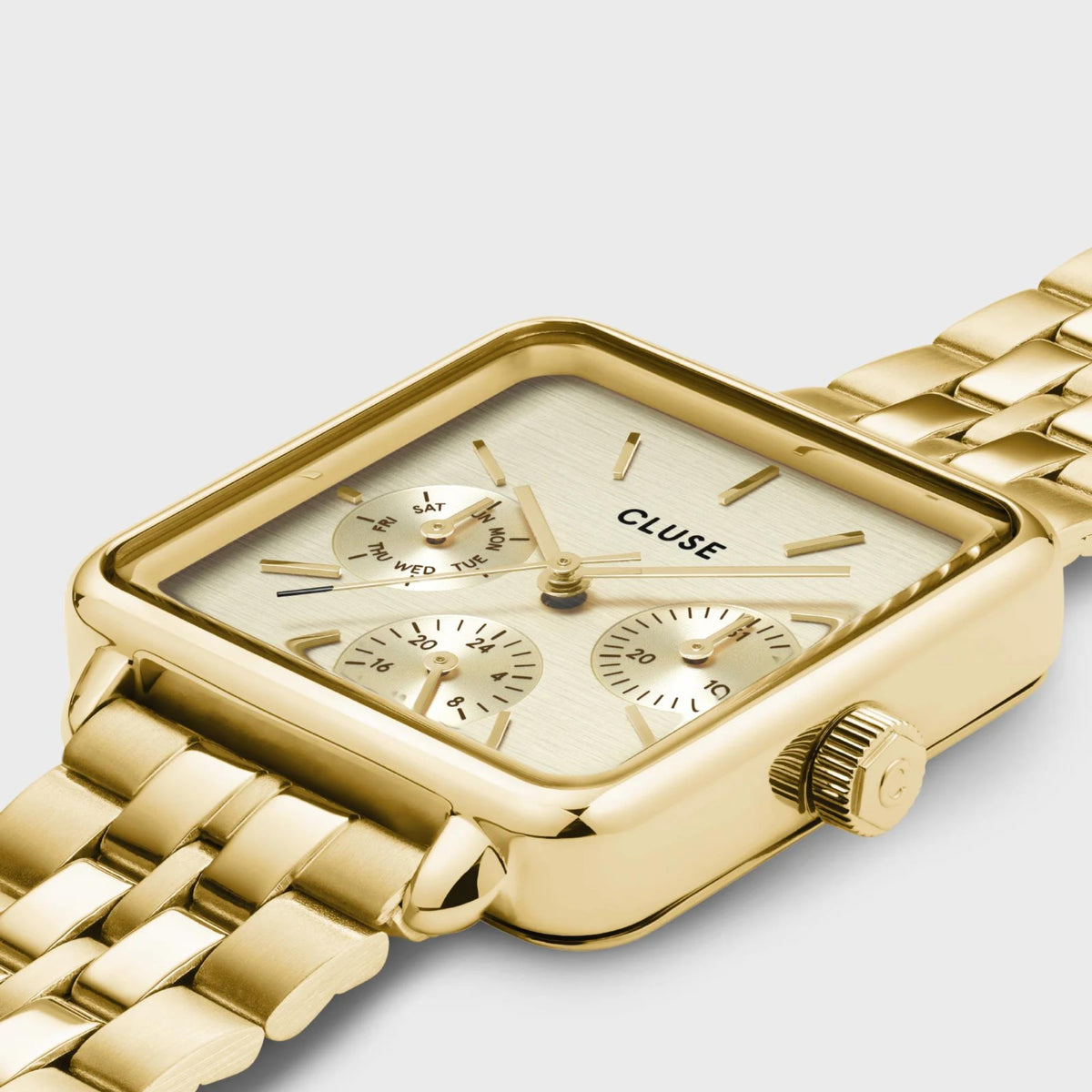 Gold-tone rectangular chronograph watch with white dial and steel bracelet strap