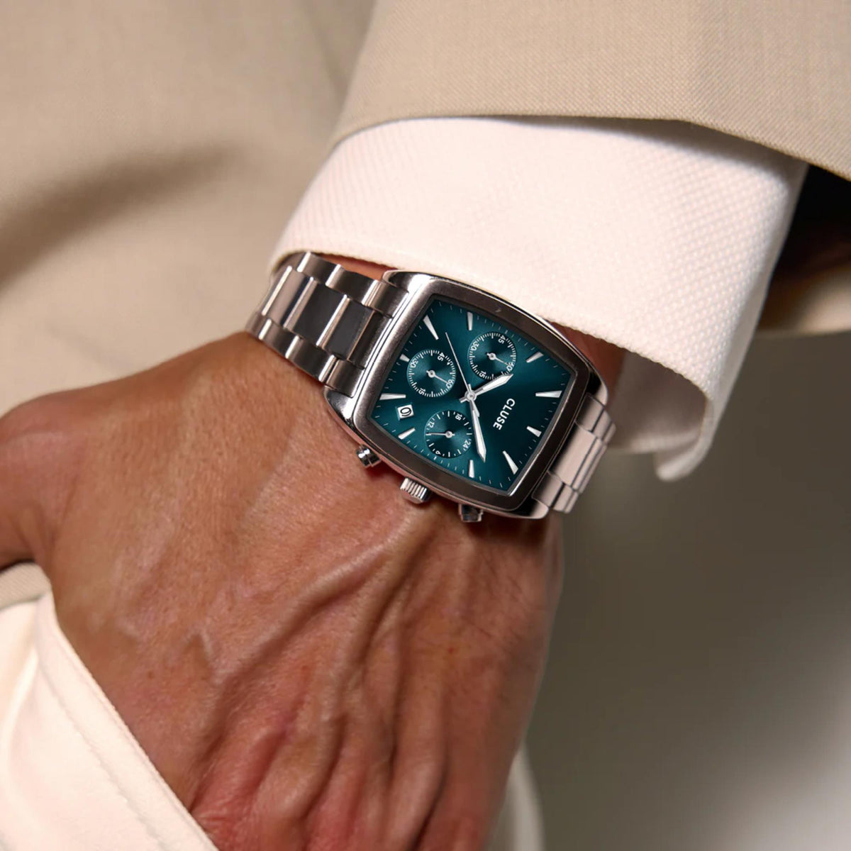 Men's steel chronograph watch with blue dial and bracelet on wrist