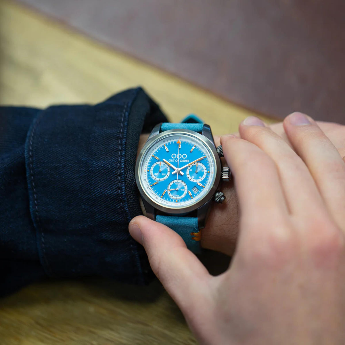 Men's chronograph quartz watch with blue dial, steel case, teal fabric strap